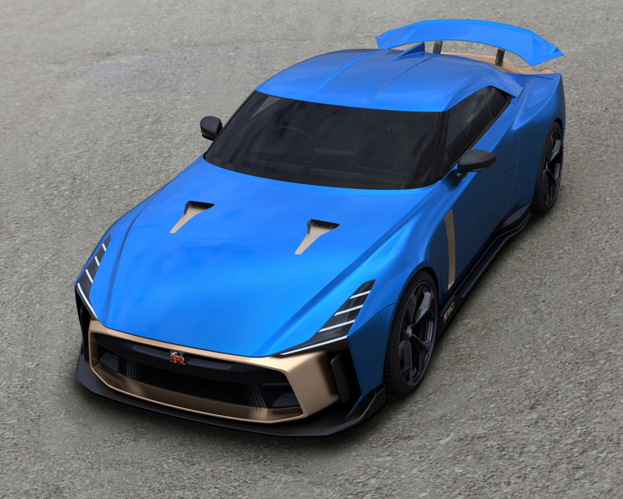 Синий автомобиль Nissan GT-R50 2019 года на сером асфальте