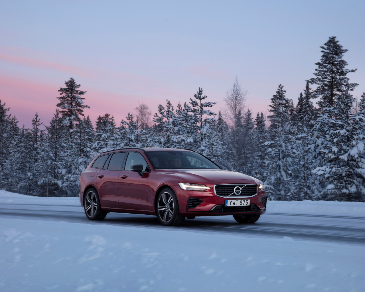 Red Volvo V60 car on a winter road