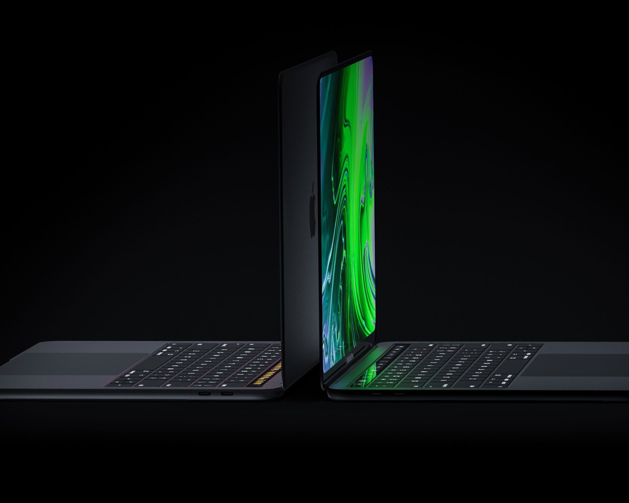 Two 2019 Apple New MacBook Pros on a Black Background