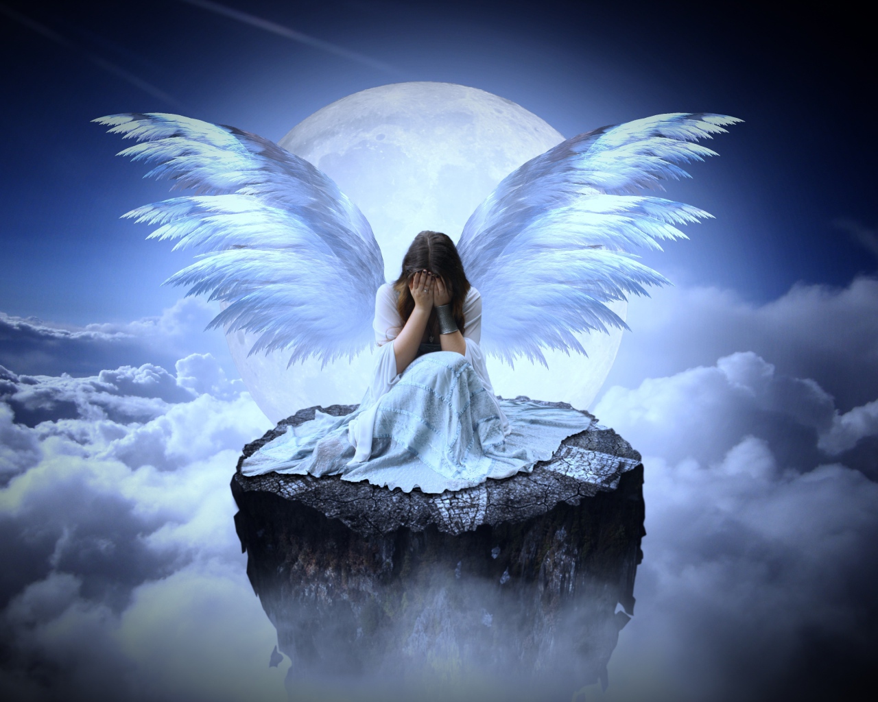Девушка с крыльями ангела сидит на камне в облаках