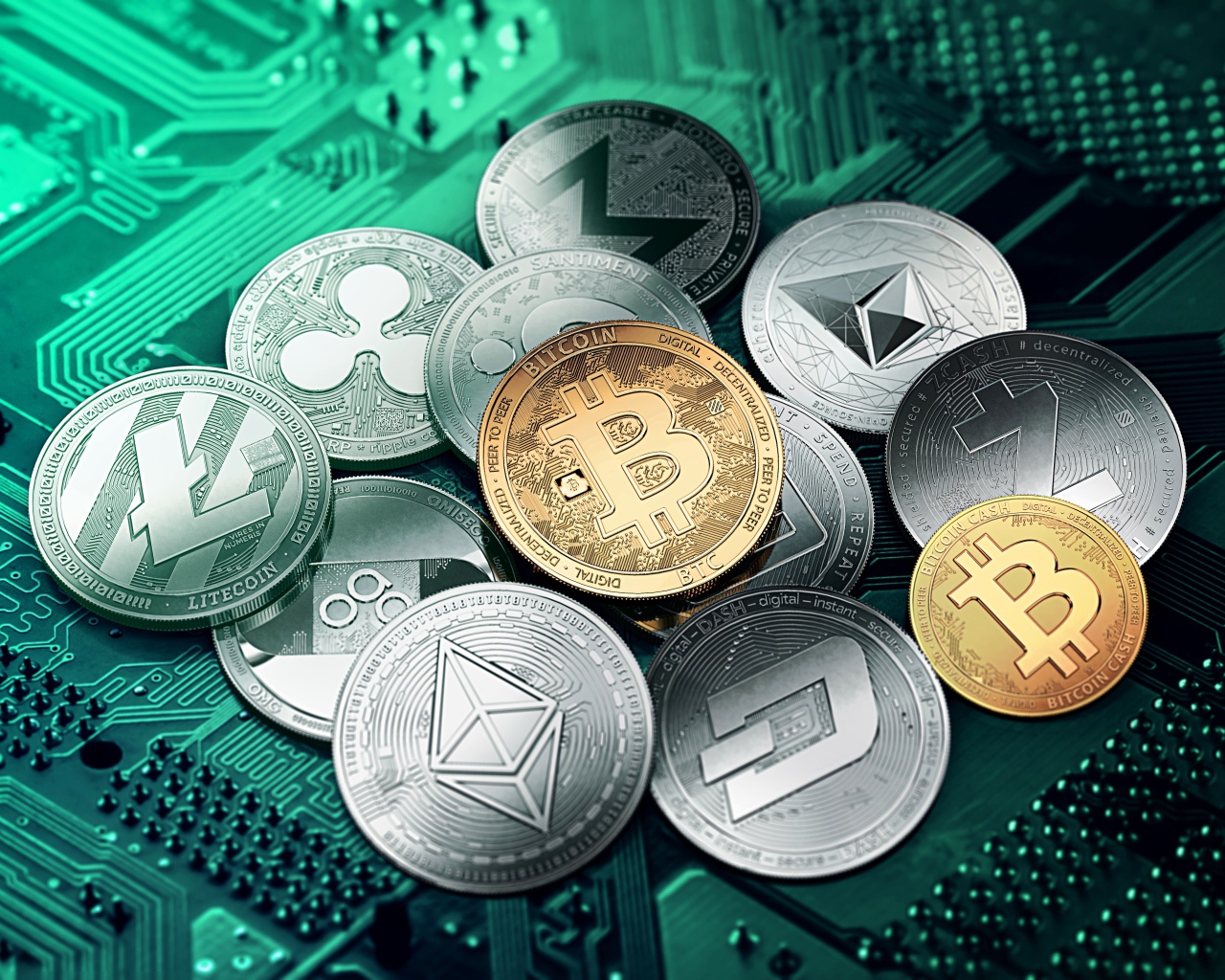 Cryptocurrency coins are on the computer board