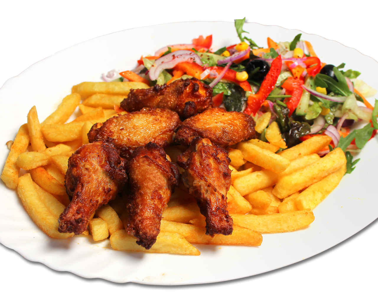 French fries with fried chicken and salad on a white plate