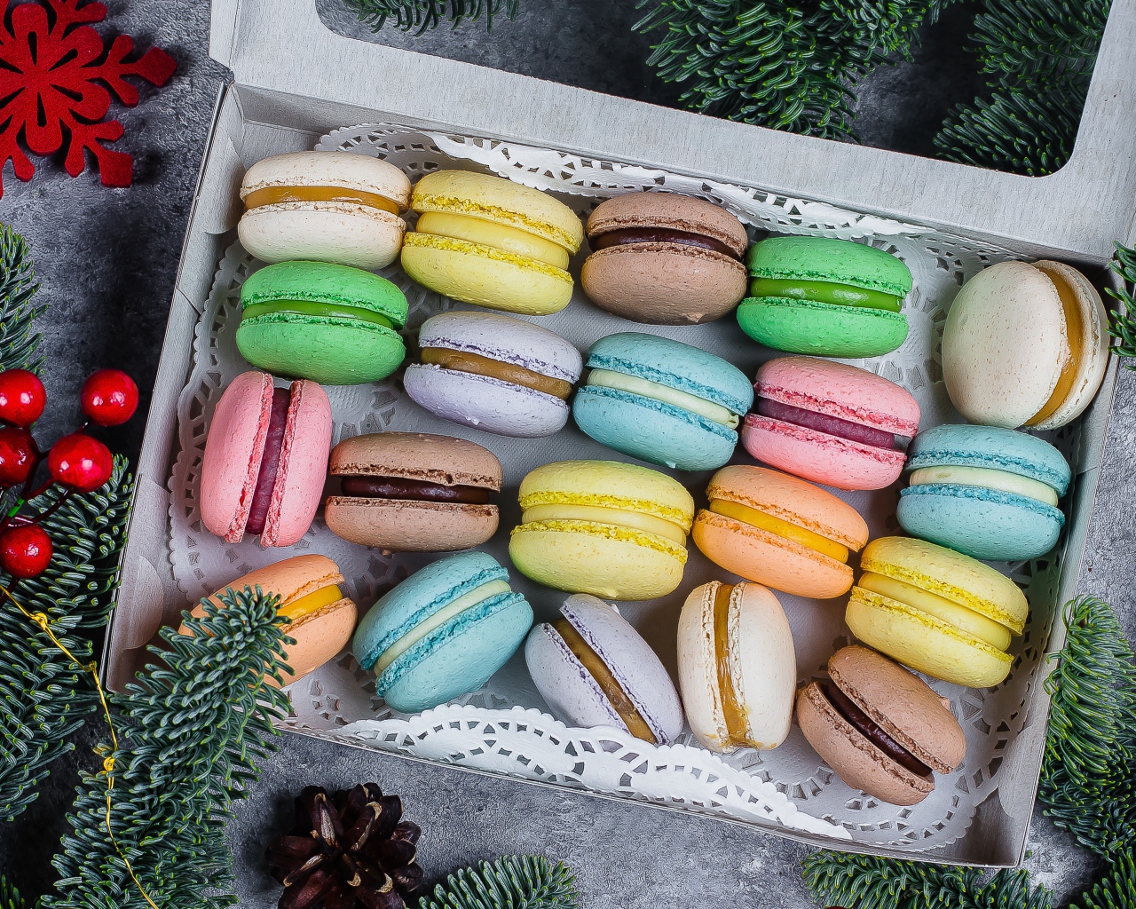 Colorful macaroon cookies in a box on the table
