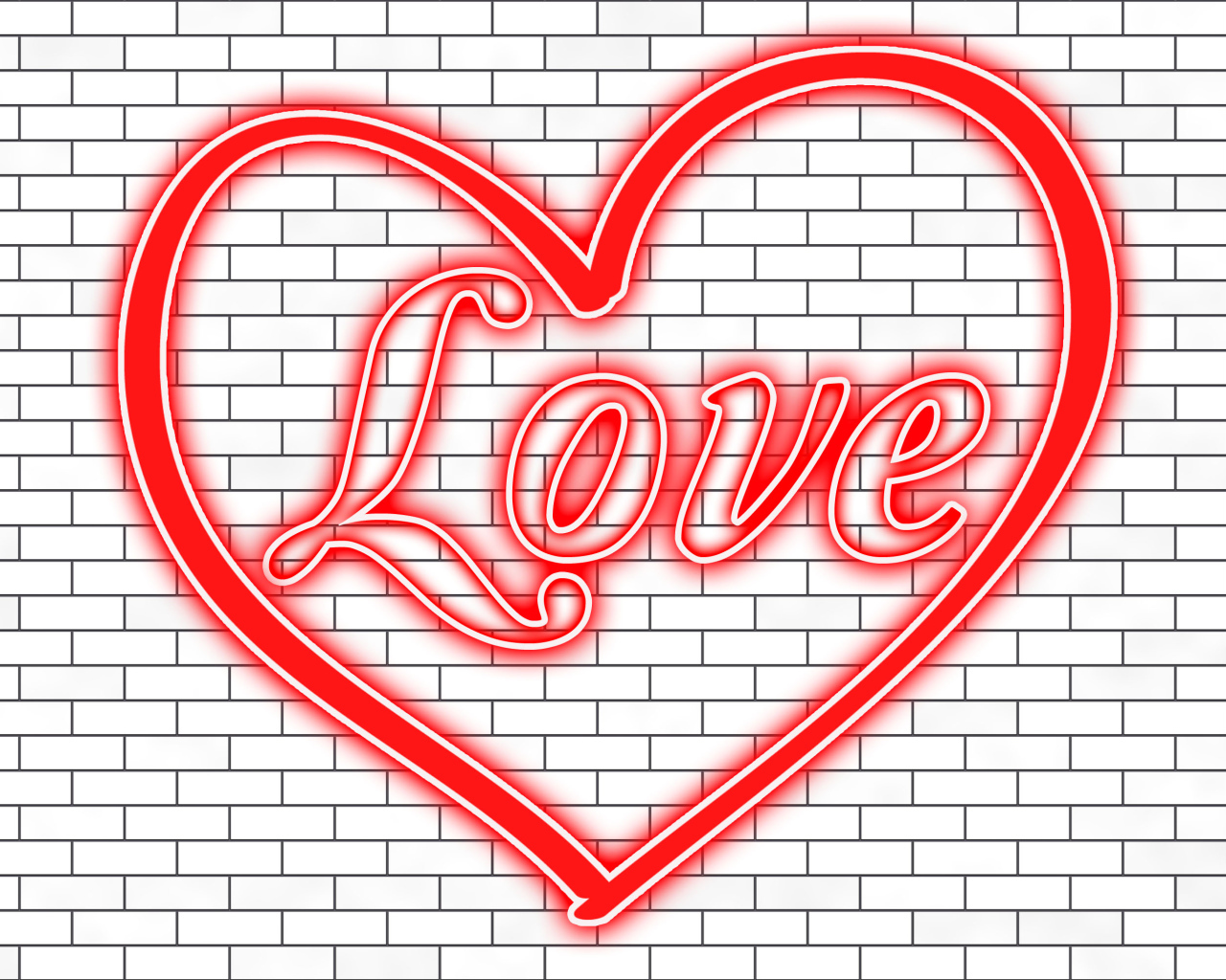 Красное сердце с надписью Любовь на кирпичной стене