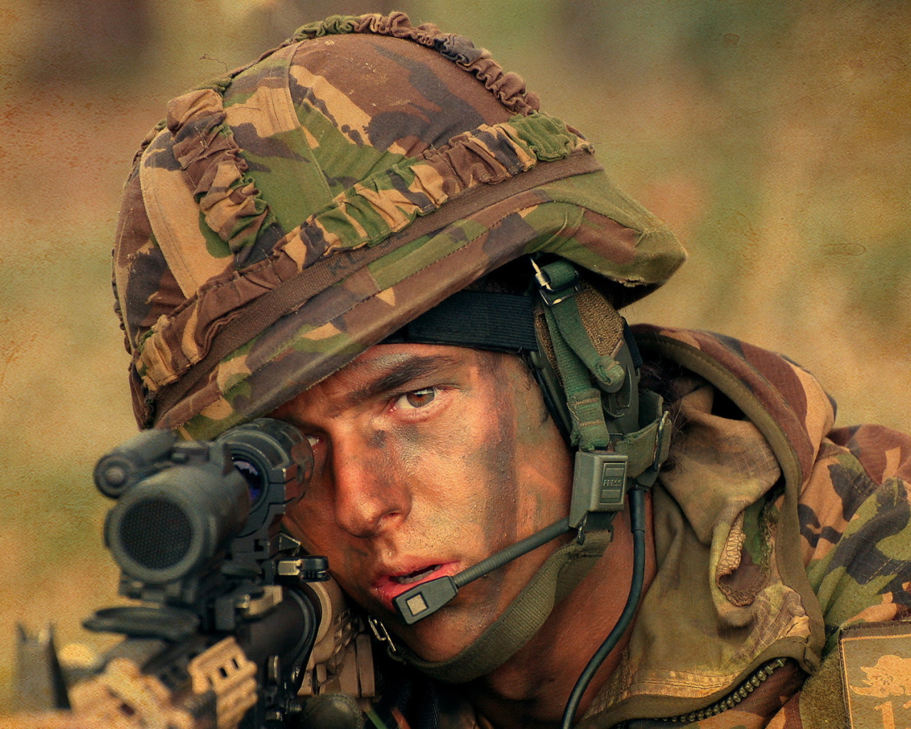 Male soldier in a helmet with a rifle