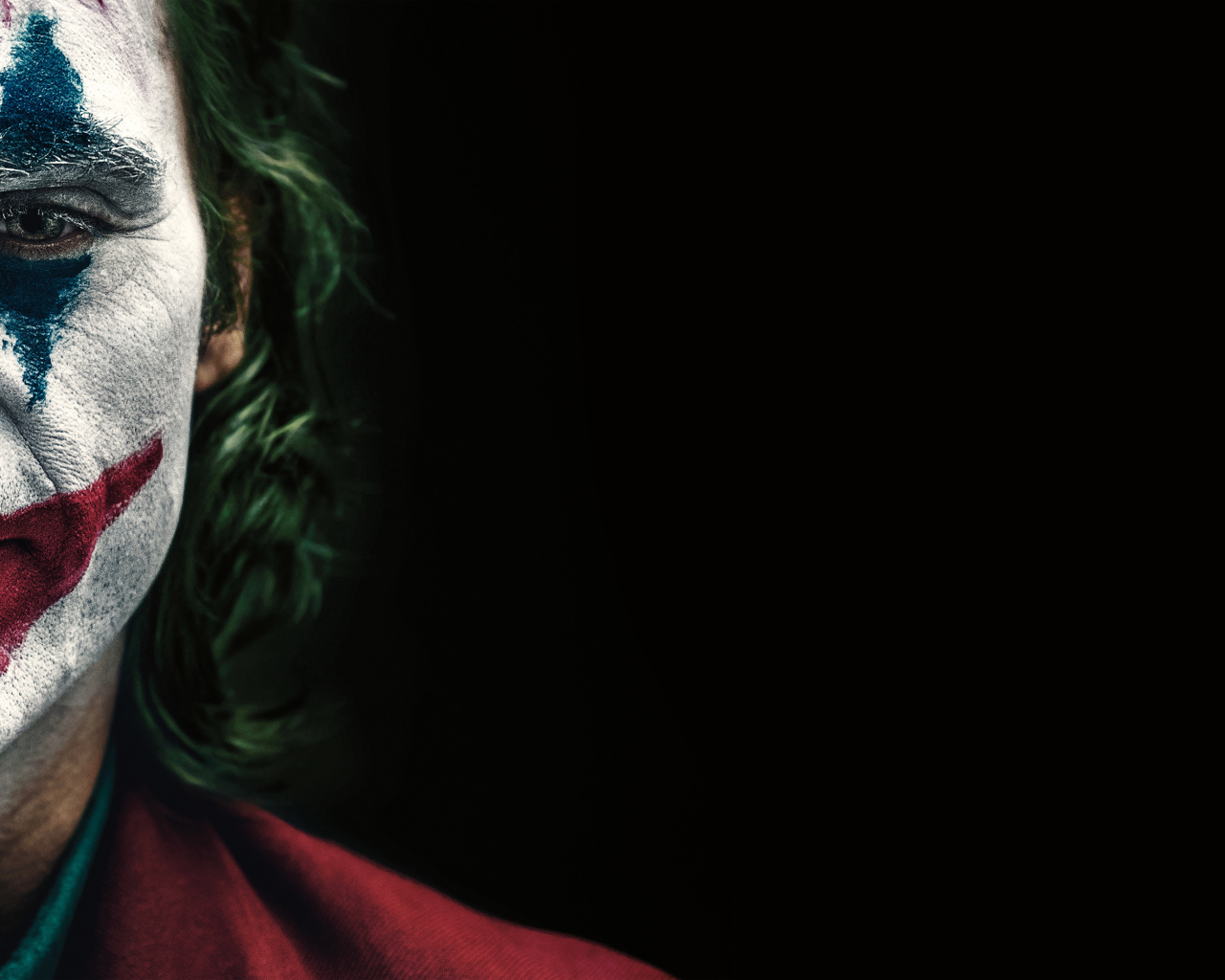 Joker movie poster on a black background, 2019