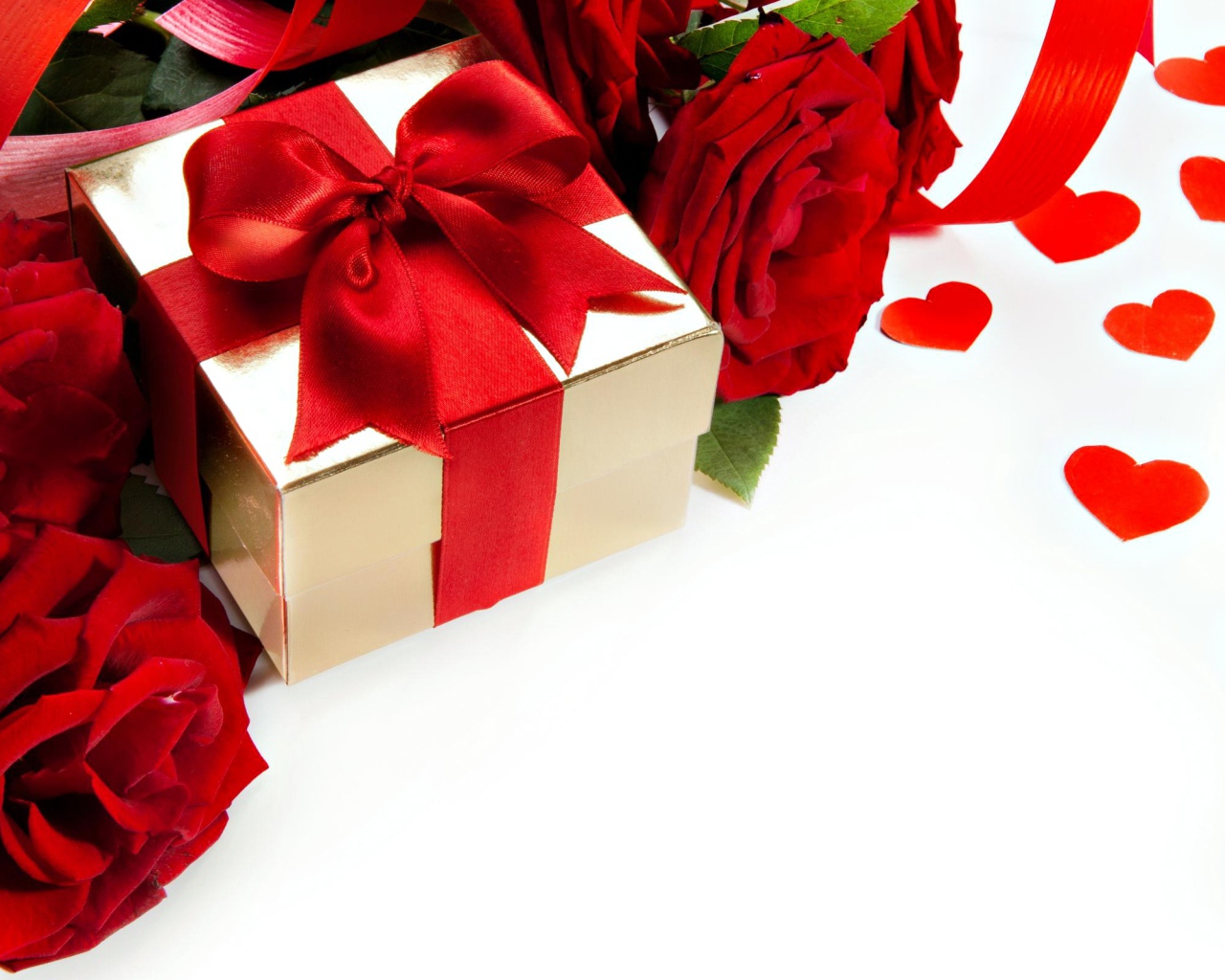 A gift with a red bow on a white background with red roses and hearts