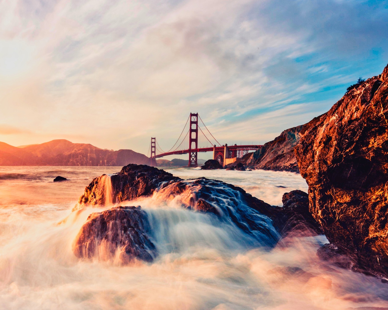 Golden Gate Bridge over a fast river in the sun