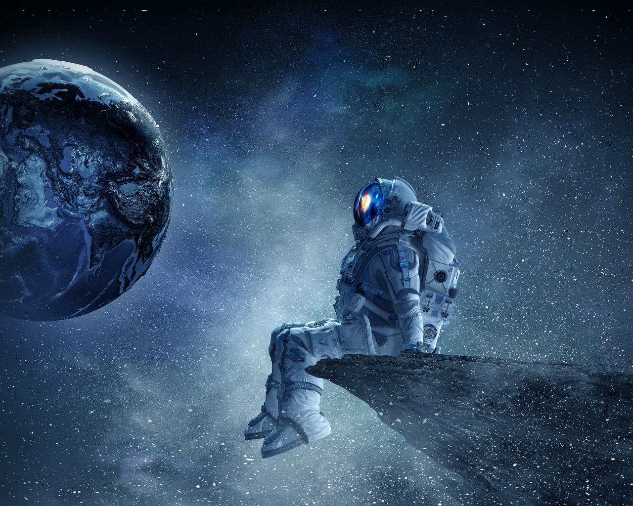 Мужчина астронавт смотрит на планету земля из космоса 