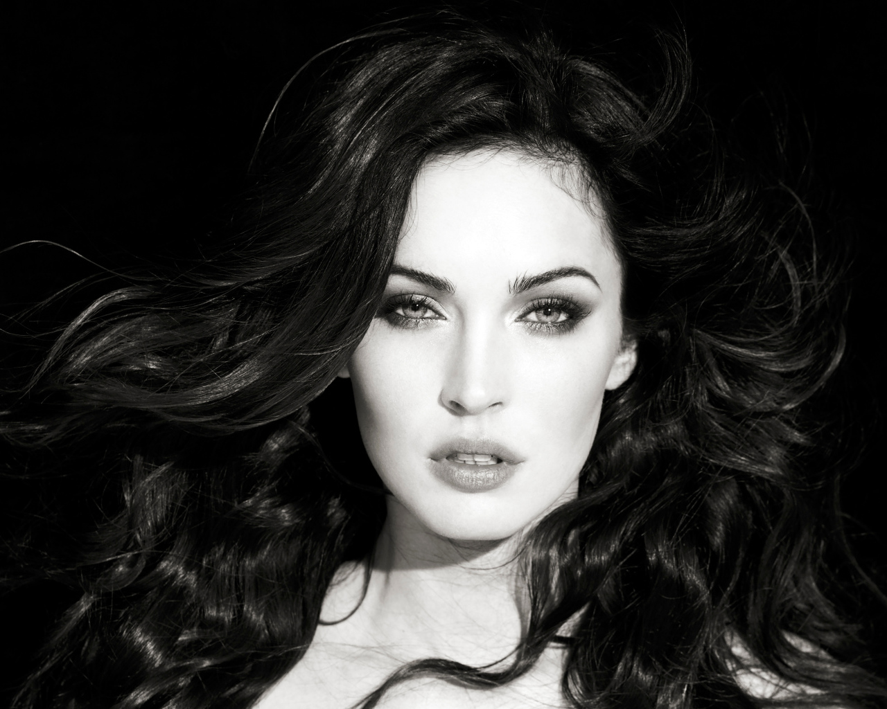 Actress Megan Fox black and white closeup photo
