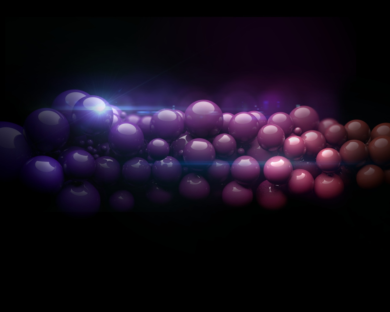 A thread of colorful balls on a black background