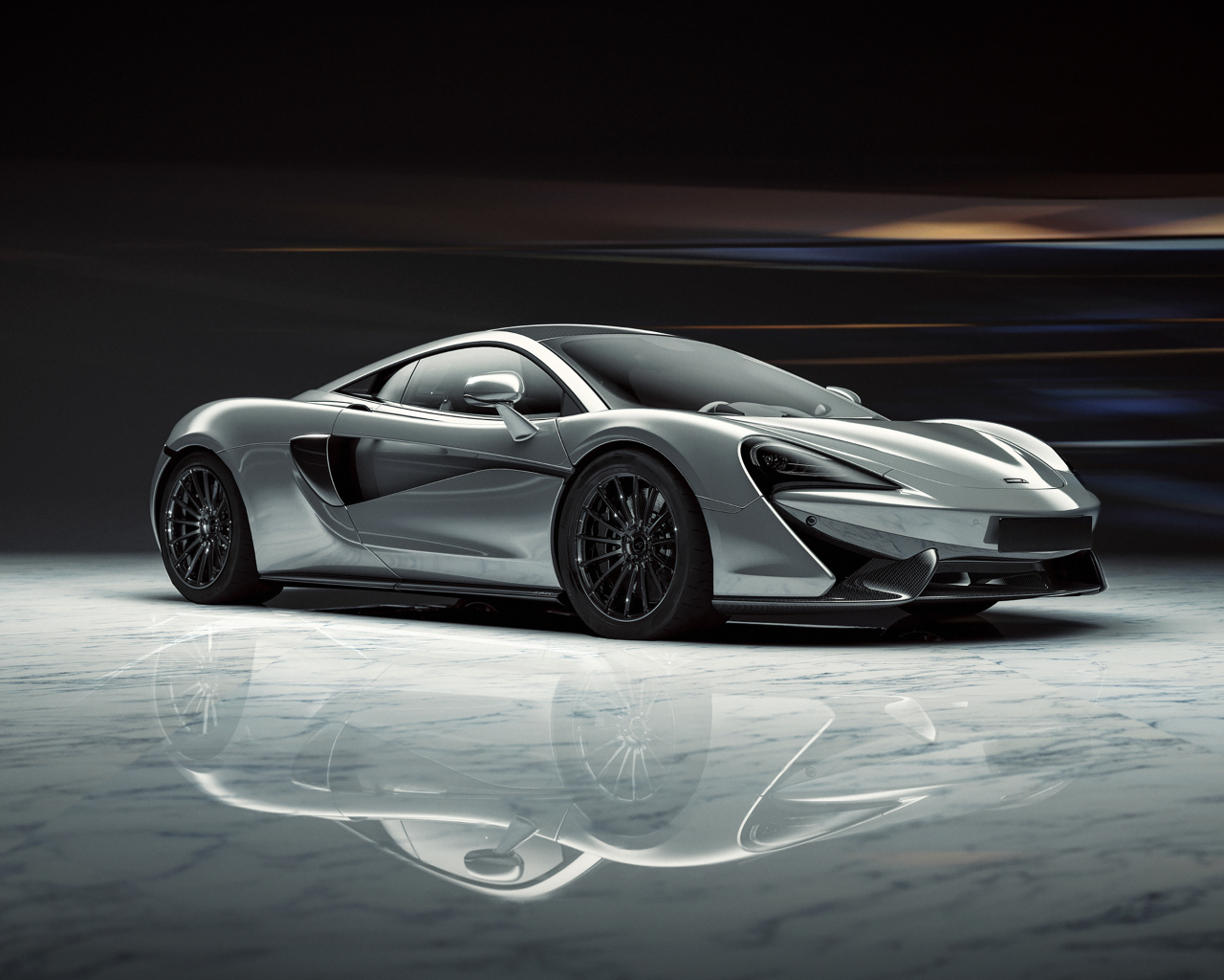Серый спортивный автомобиль McLaren 520S 