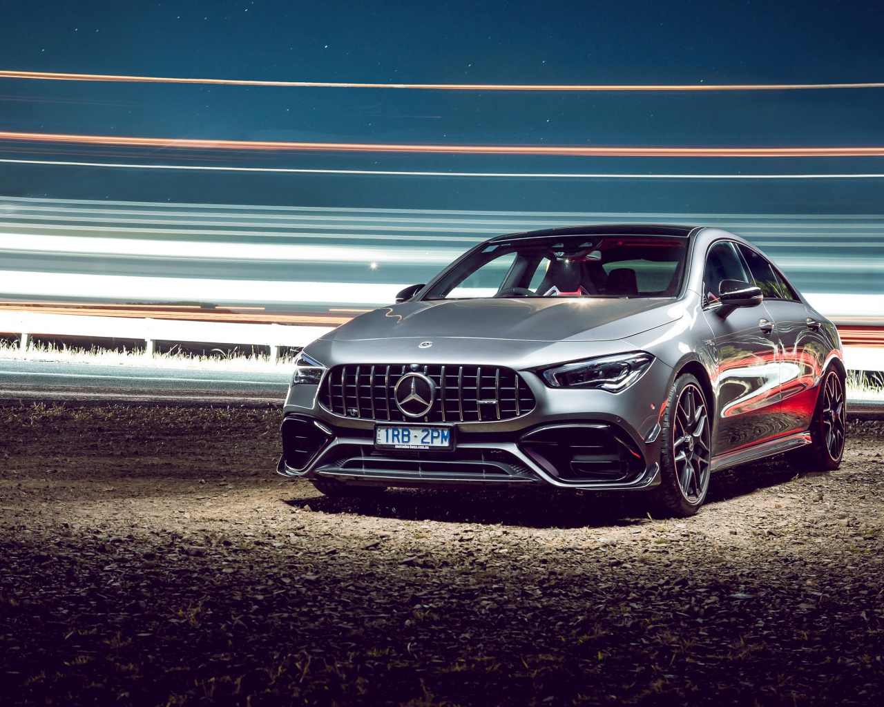Серебристый автомобиль Mercedes-AMG CLA 45 S 4MATIC, 2020 года у трассы 