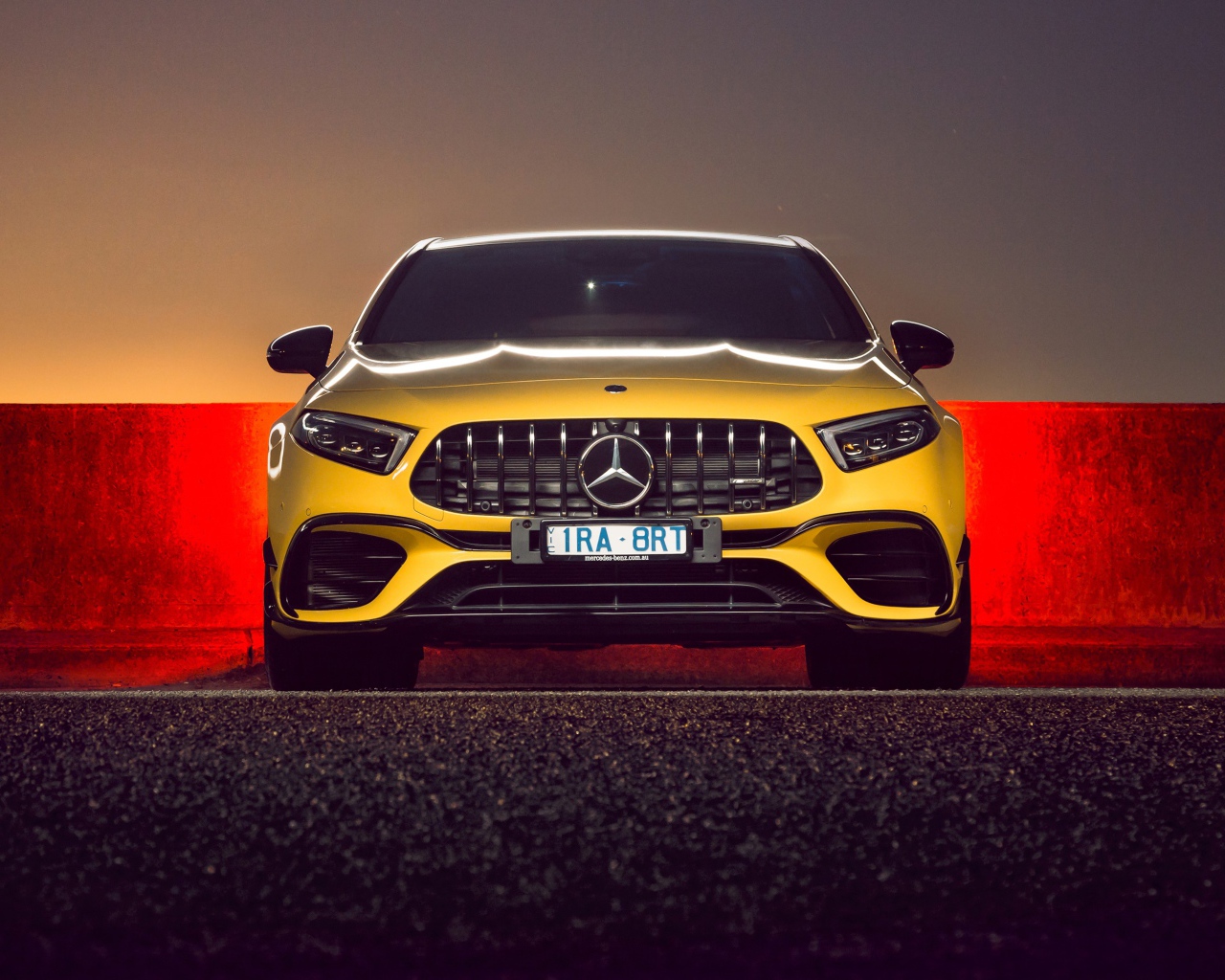 Желтый автомобиль Mercedes-AMG A 45 S,  2020 года вид спереди
