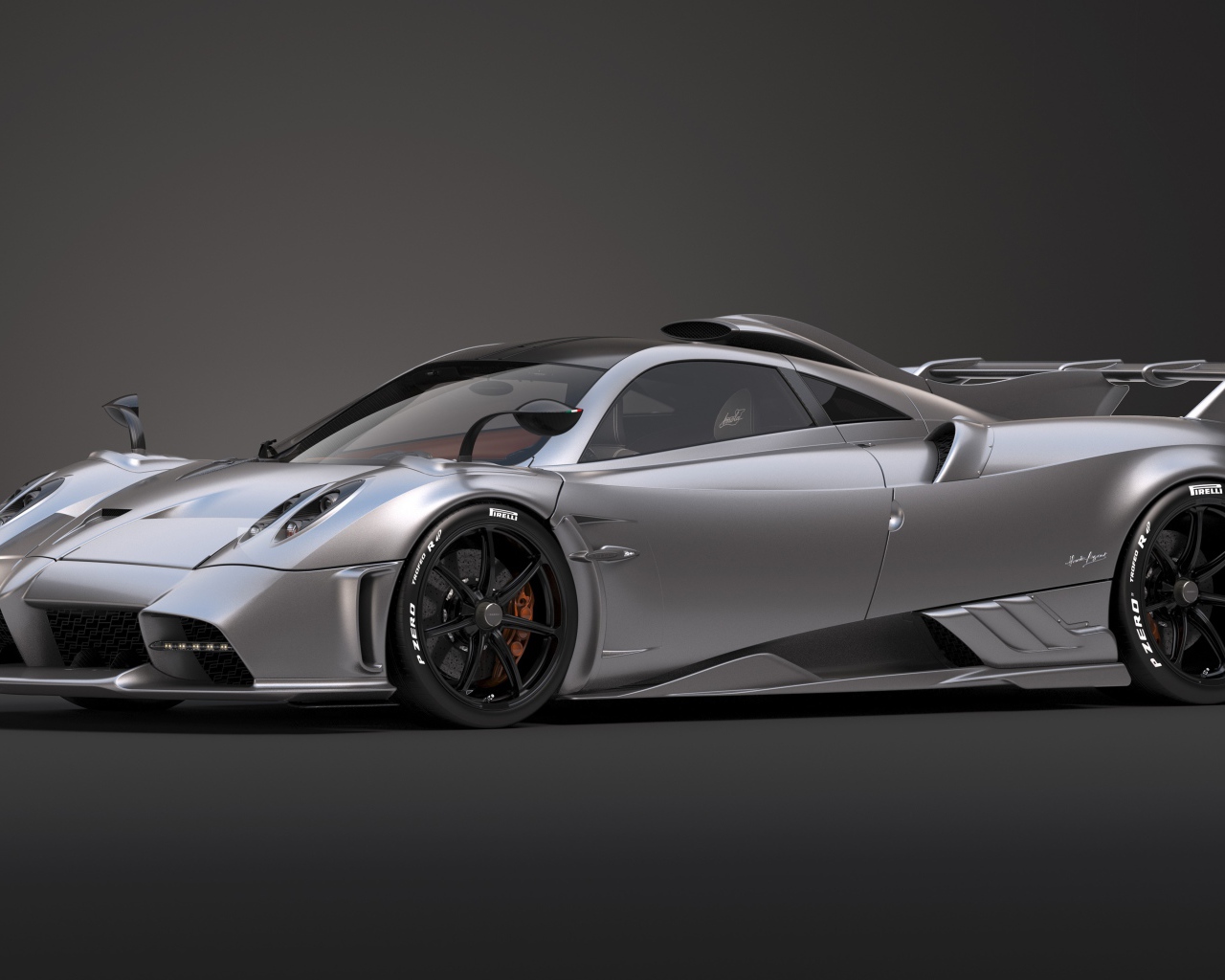 Серебристый автомобиль Pagani Imola 2020 года на сером фоне