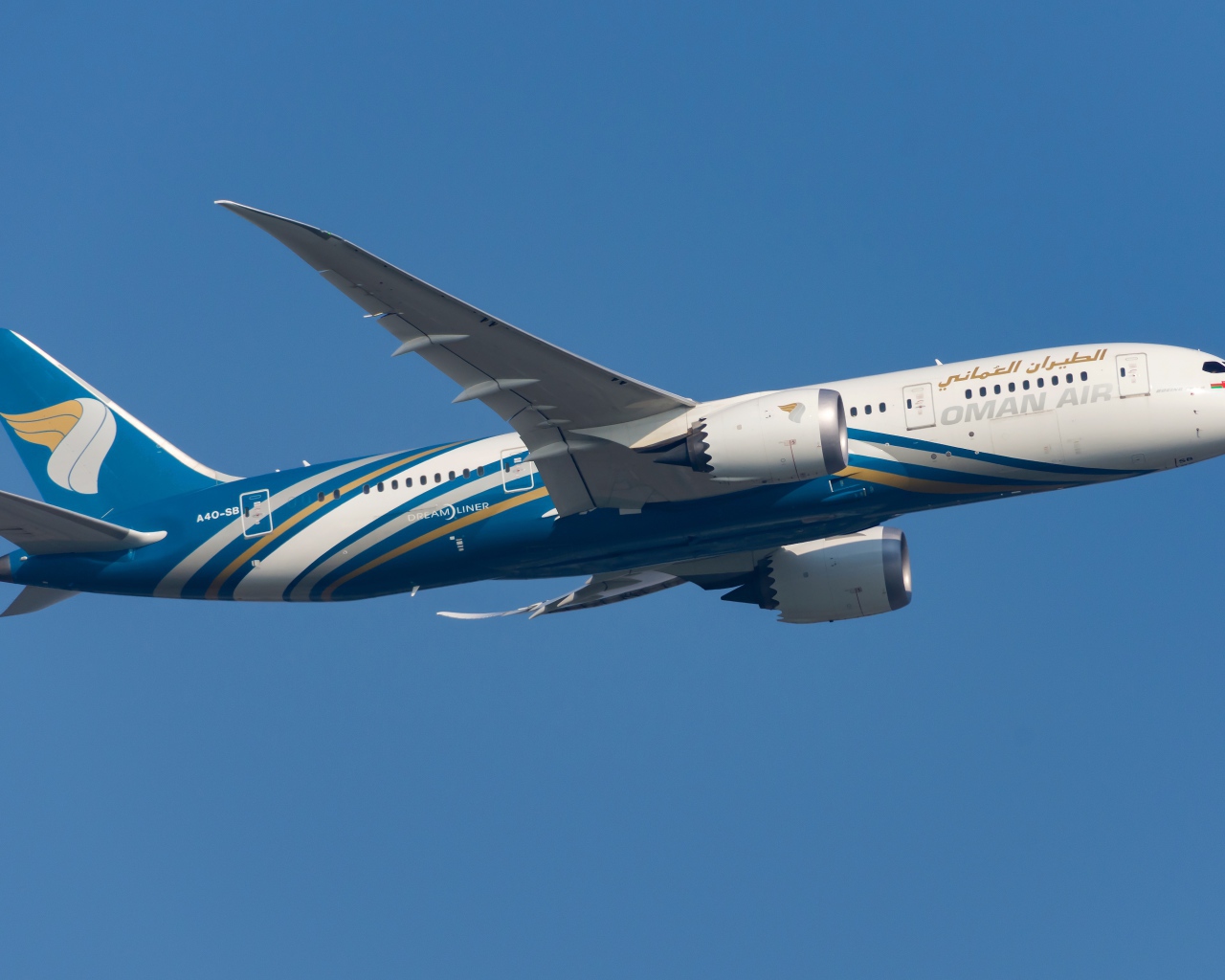 Oman Air passenger Boeing 787-8 in the blue sky