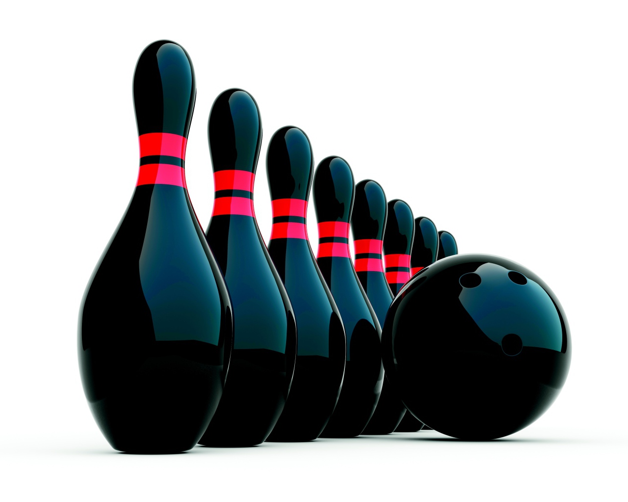 Черные кегли и шар для боулинга на белом фоне
