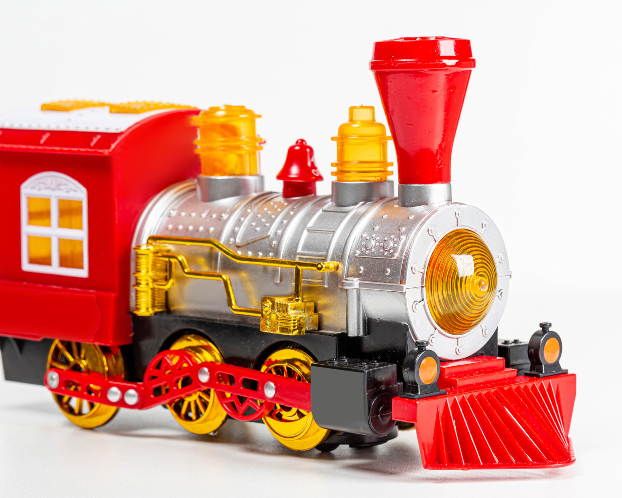Children's toy steam engine on a white background