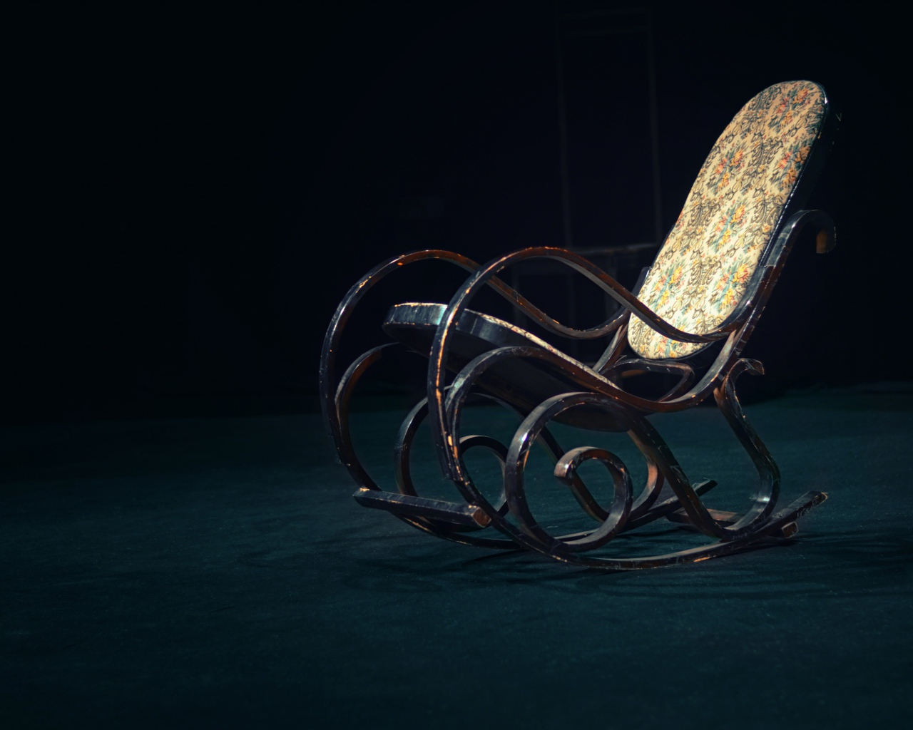 Old rocking chair in a dark room