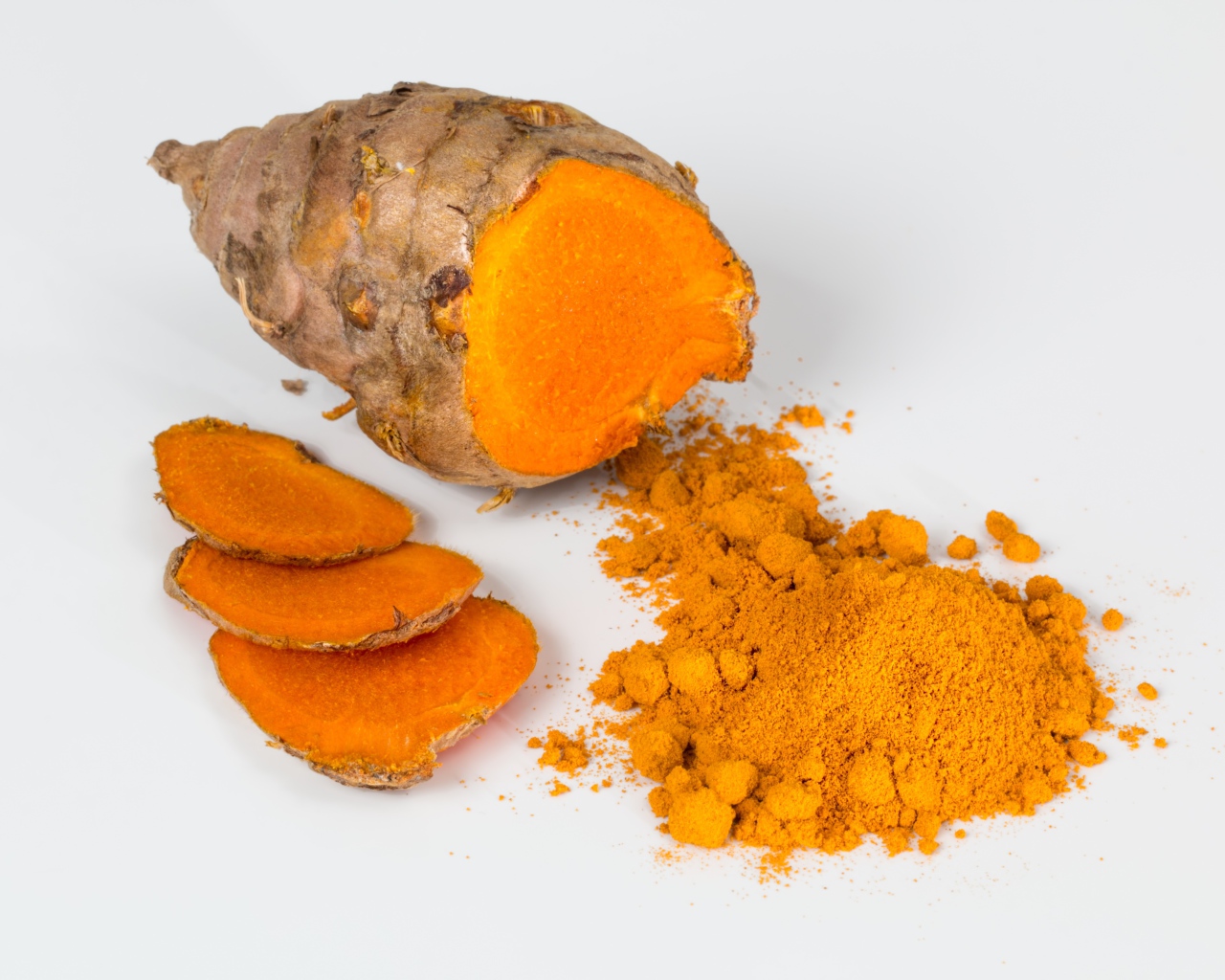 Turmeric root on gray background