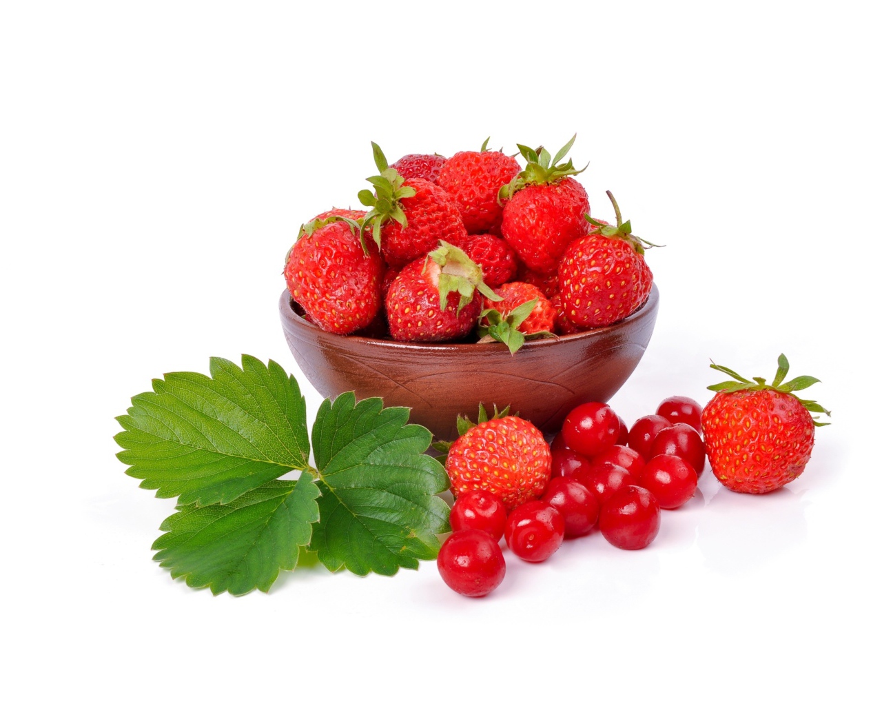 Red strawberry on white plate with berries of chinese cherry