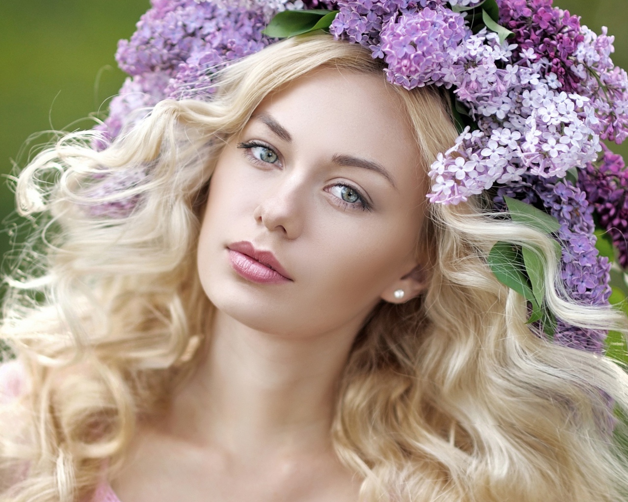 Beautiful blonde with a wreath of lilac in her hair