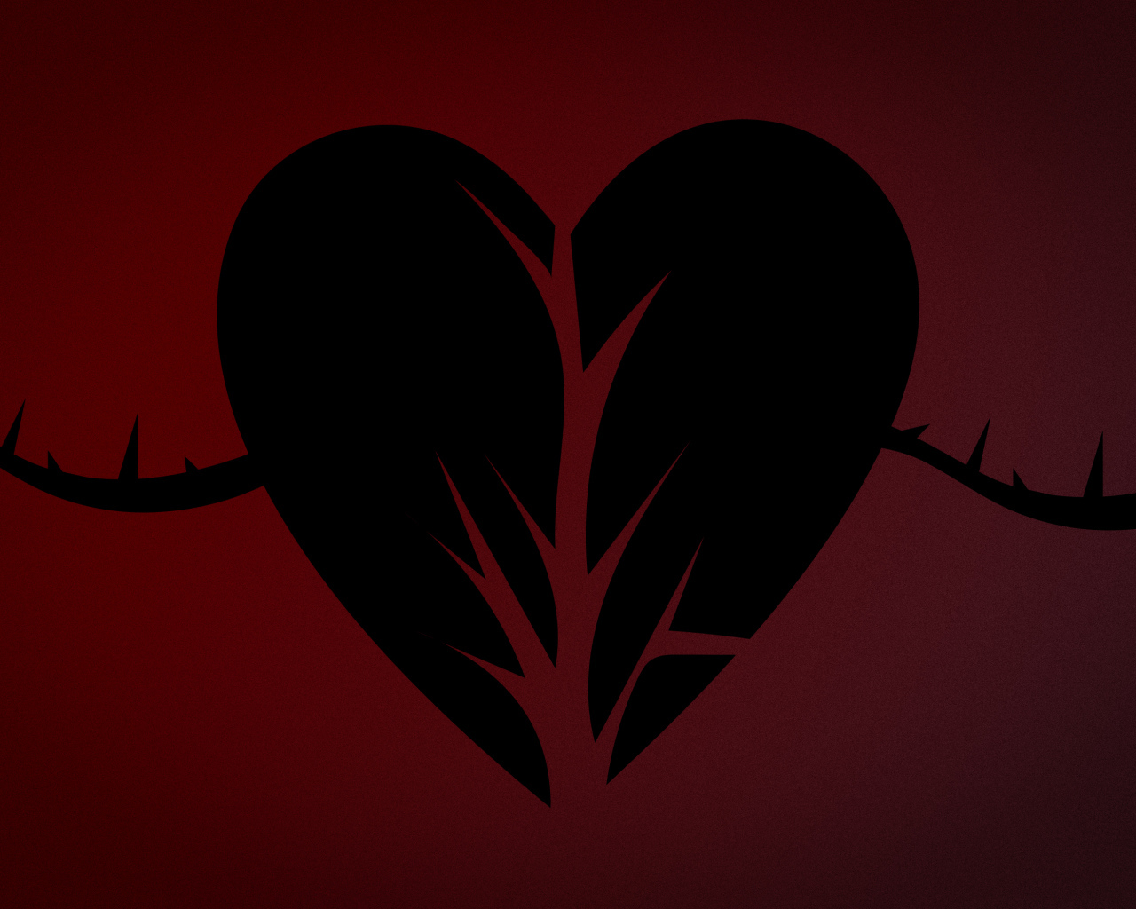 Черное разорванное сердце на красном фоне
