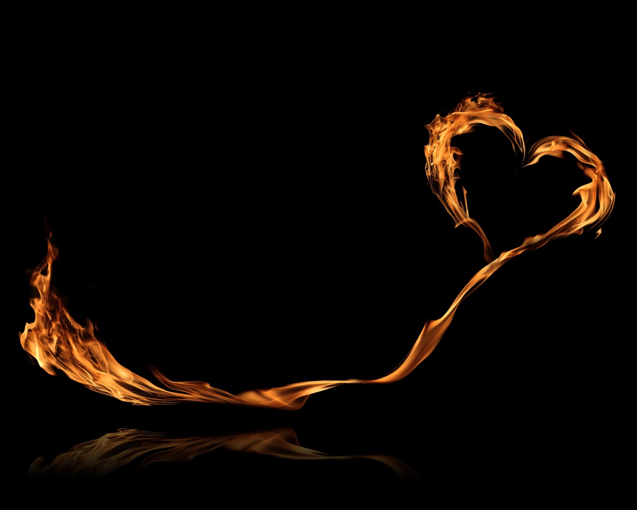 Bright fiery heart with a long tail on a black background