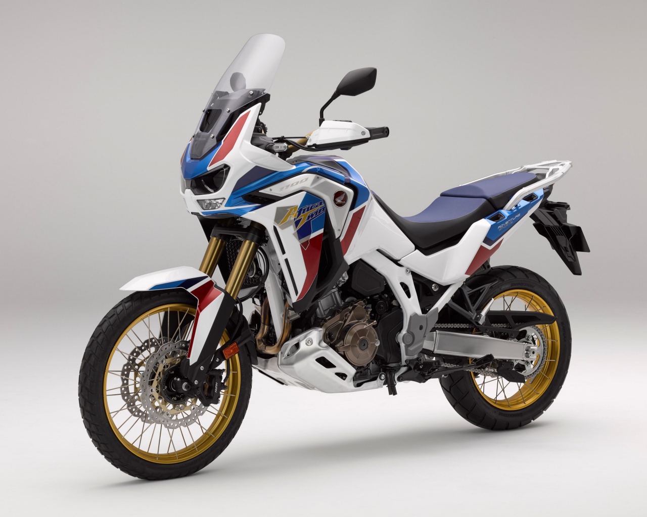 Спортивный мотоцикл Honda  CRF 1000 D, 2020  года на сером фоне