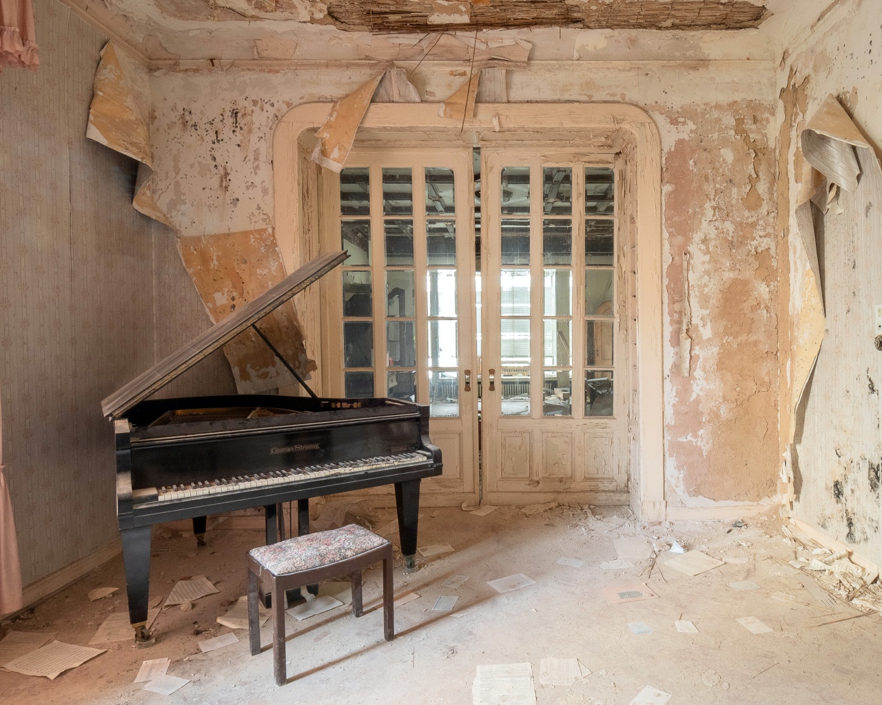 Old abandoned apartment with a grand piano