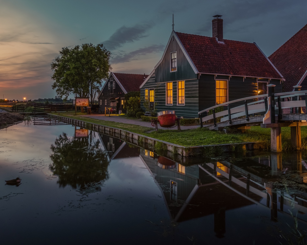 Small houses by the pond in the evening