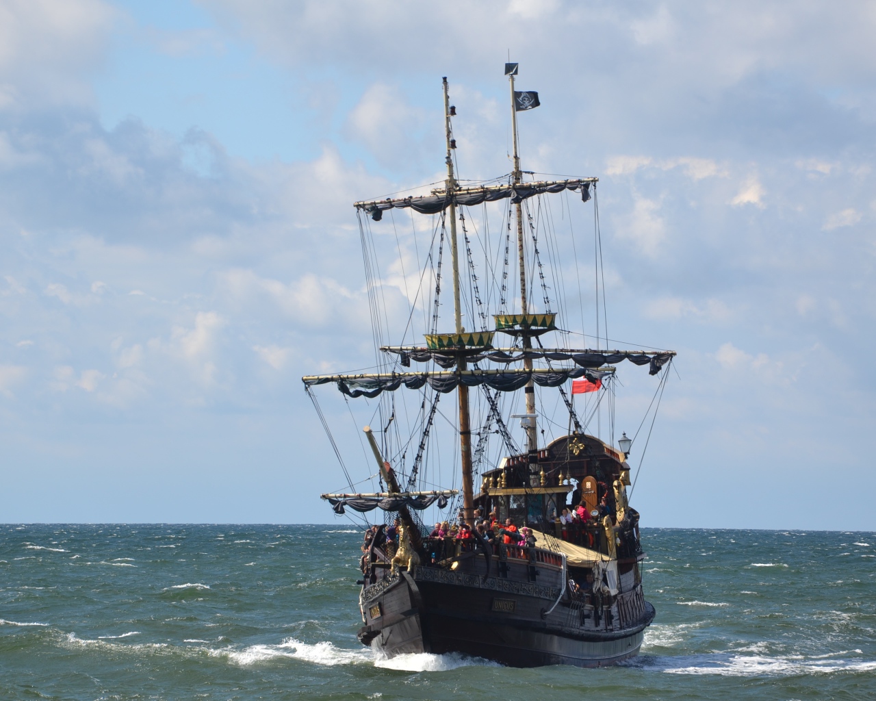 Big black pirate ship at sea