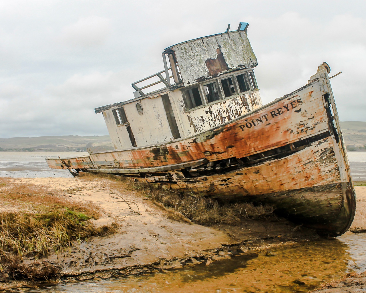 Old abandoned fishing boat on the shore