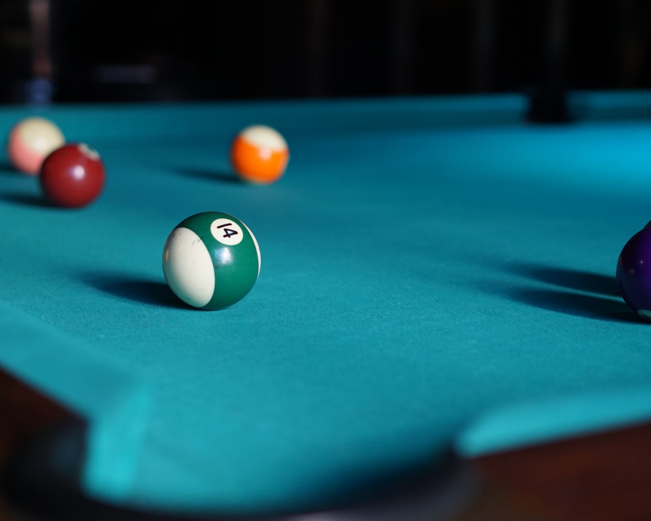 Blue billiard table with balls