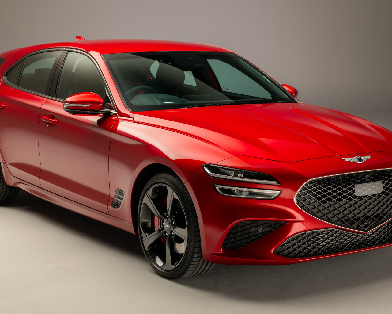 Красный Genesis G70 2.0T Shooting Brake 2021 года на сером фоне