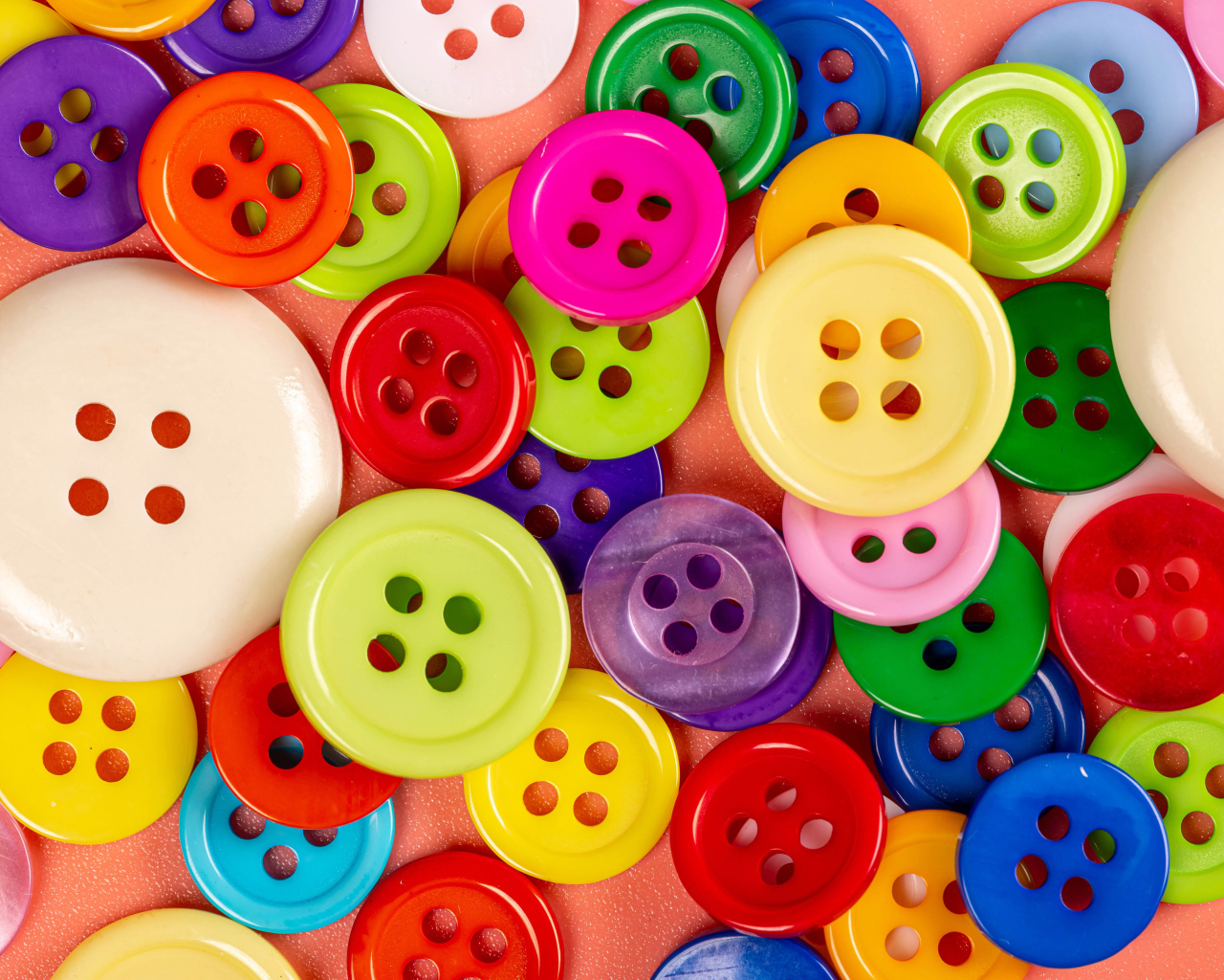 Many multi-colored buttons of different sizes