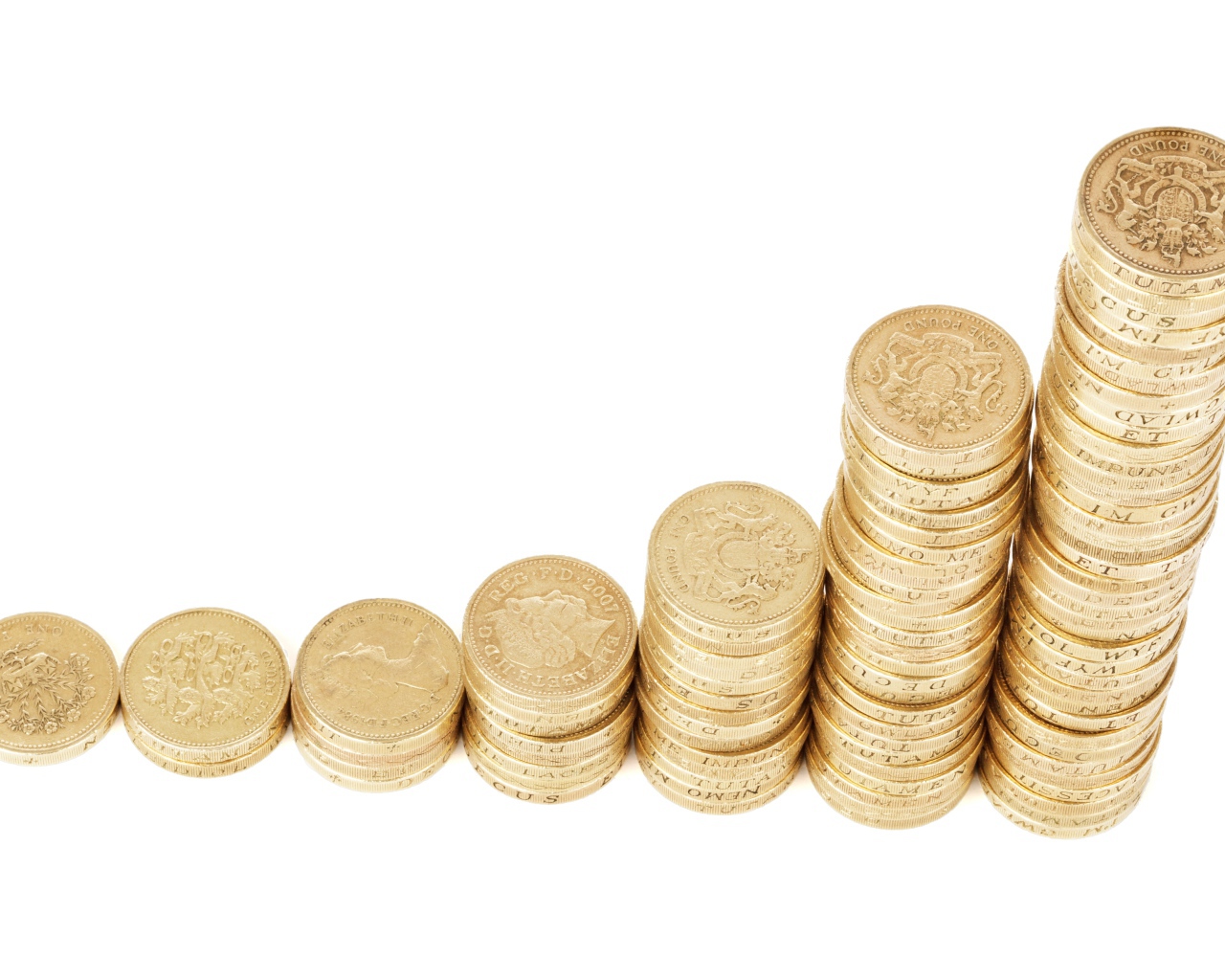Stacks of gold coins on a white background