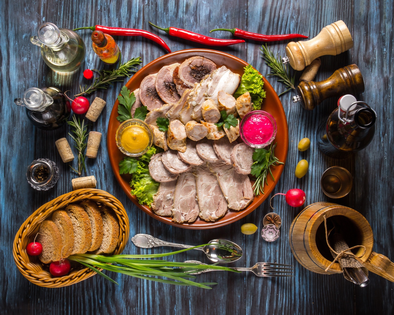 Appetizing cold cuts on the table with spices and bread