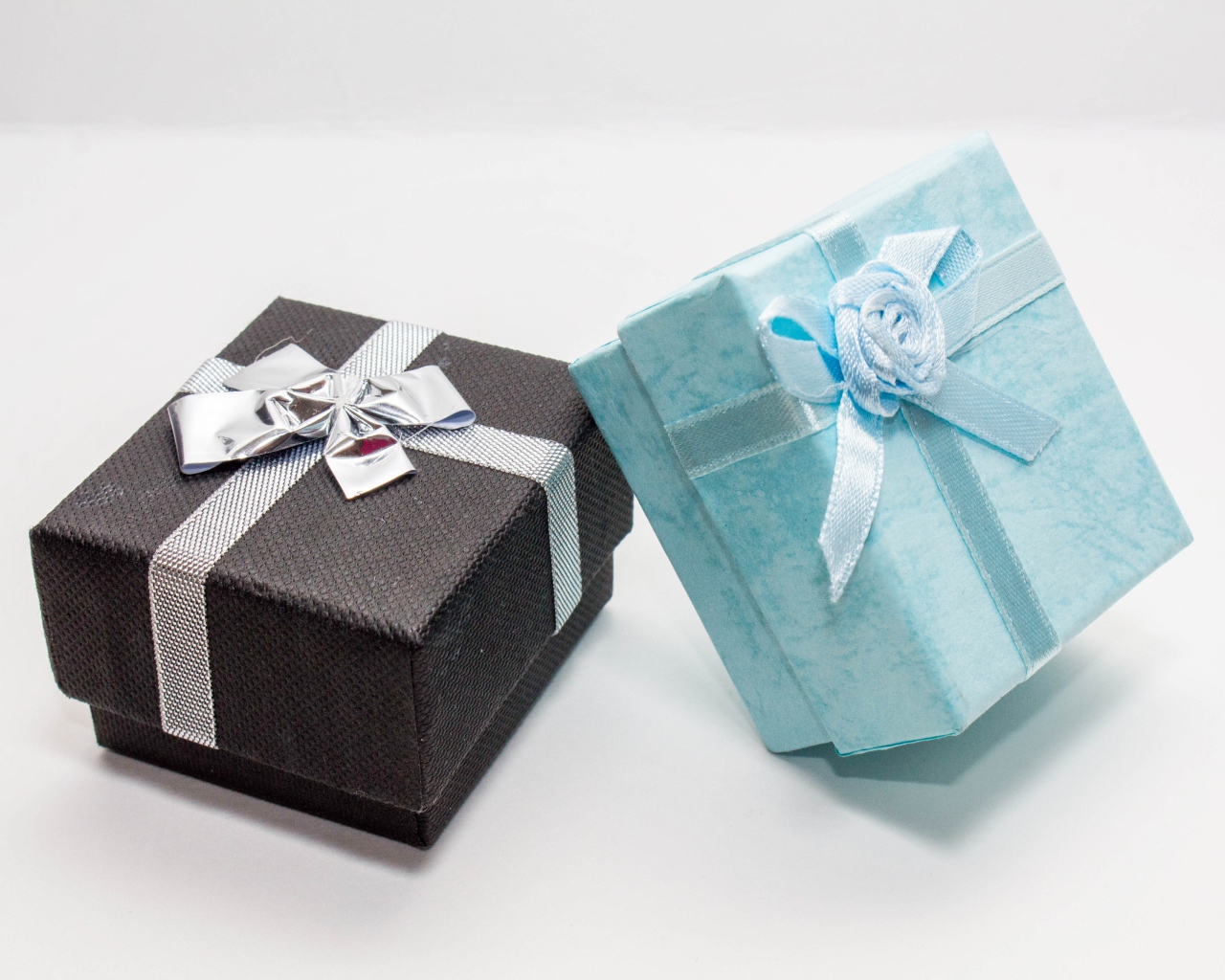 Two boxes with gifts on a gray background