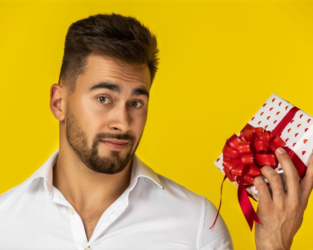 Man with a gift on a yellow background