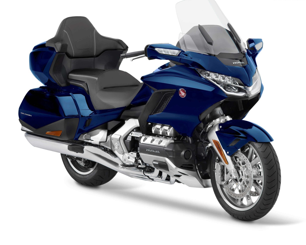 Blue Honda Gold Wing motorcycle on a white background