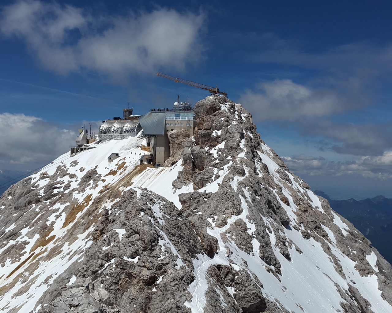 Zugspitze peak in snow under blue sky