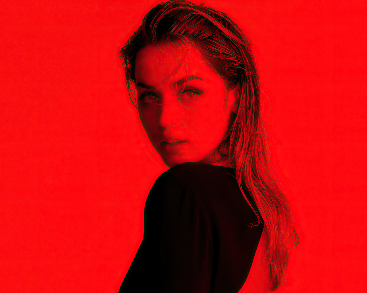 Испанская актриса Ана де Армас на красном фоне