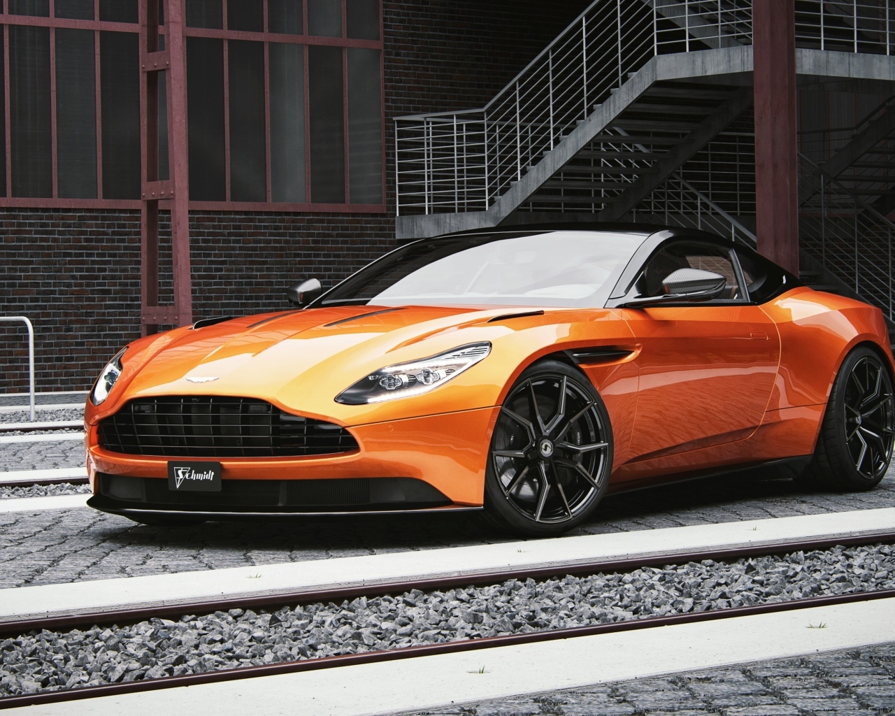 Оранжевый автомобиль Aston Martin DB11