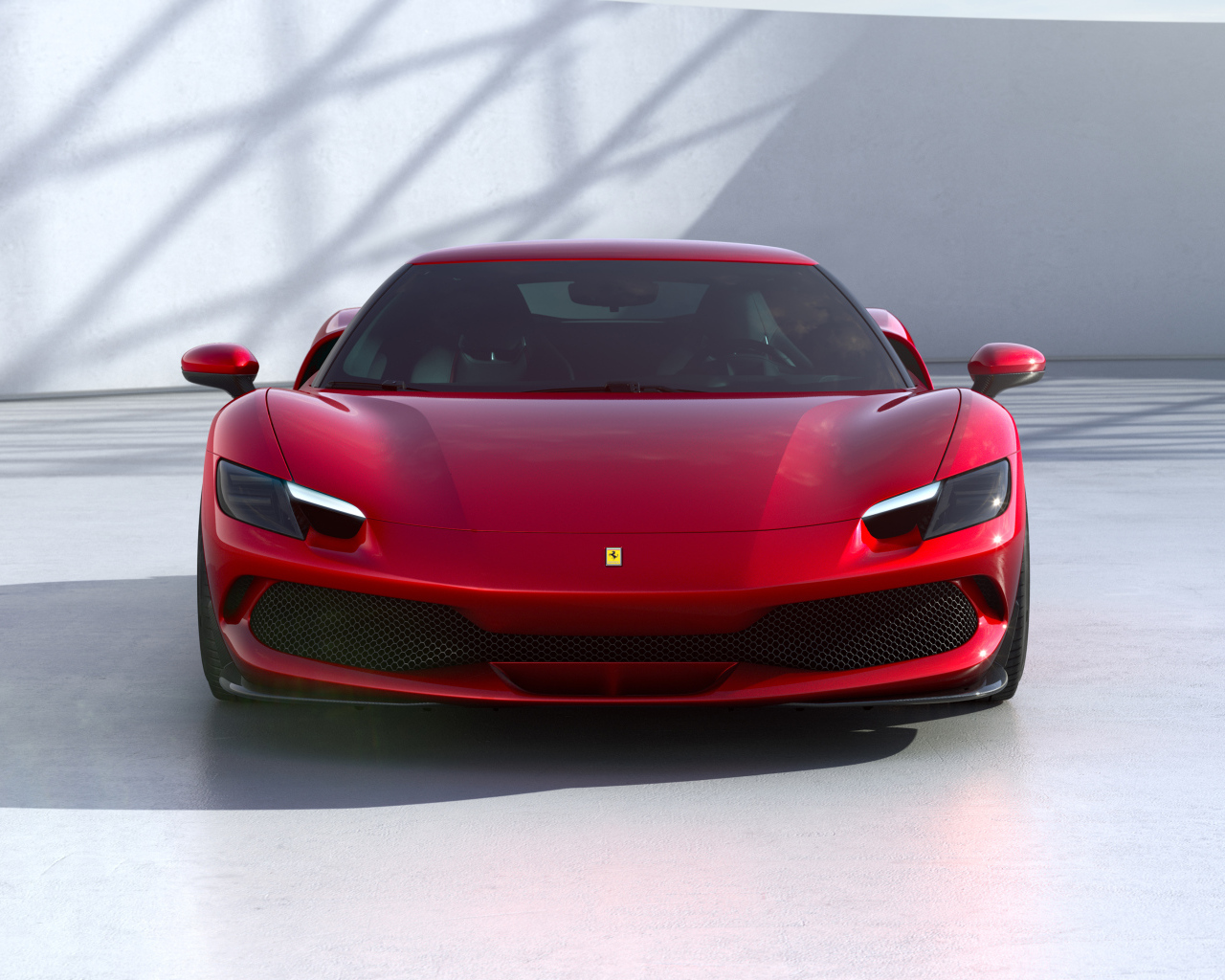 Красный Ferrari 296 GTB 2022 года вид спереди