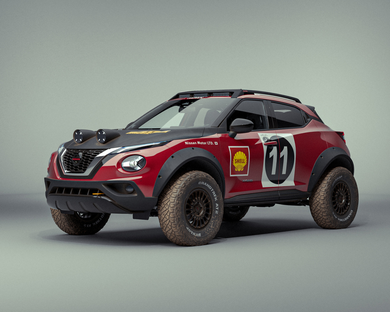 Автомобиль Nissan Juke Rally Tribute Concept 2021 года на сером фоне 