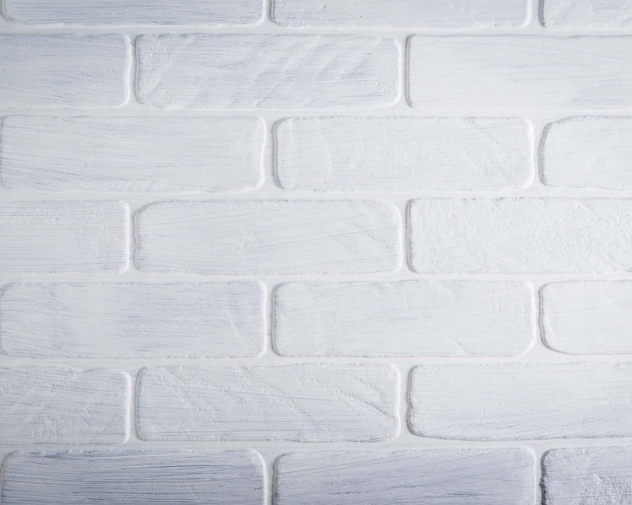 Белая кирпичная стена крупным планом