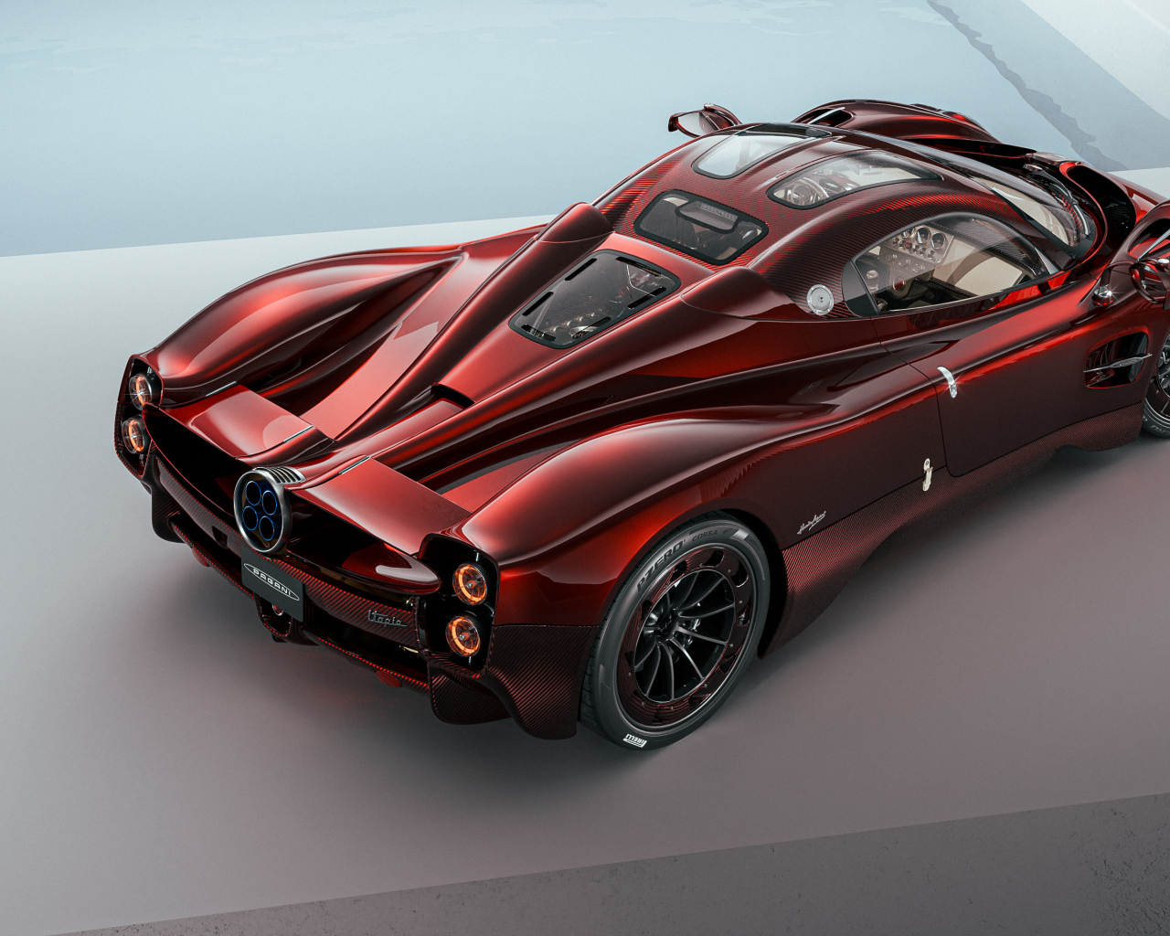 Вид сзади на красный автомобиль Pagani Utopia