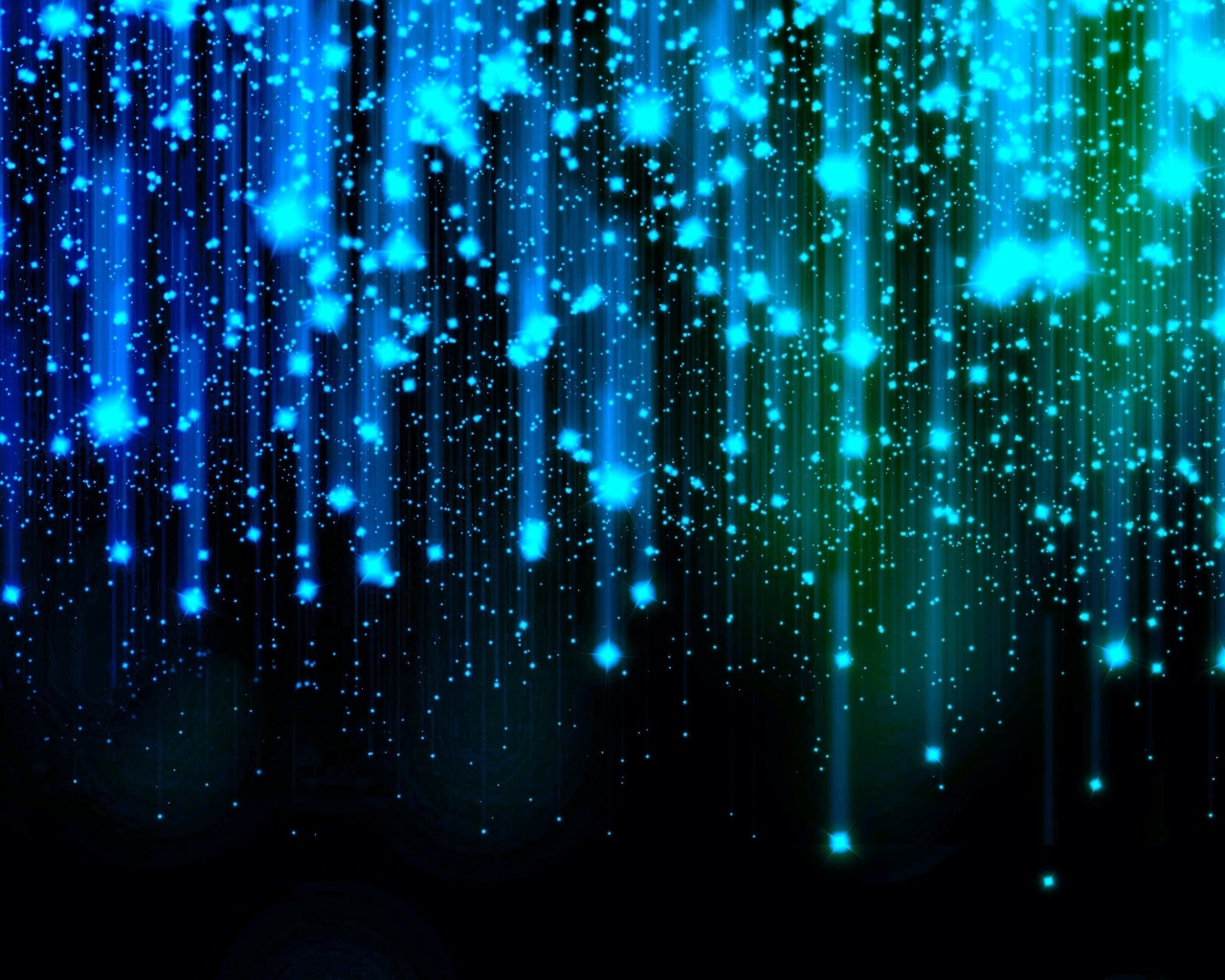 Яркие искры летят вниз на черном фоне