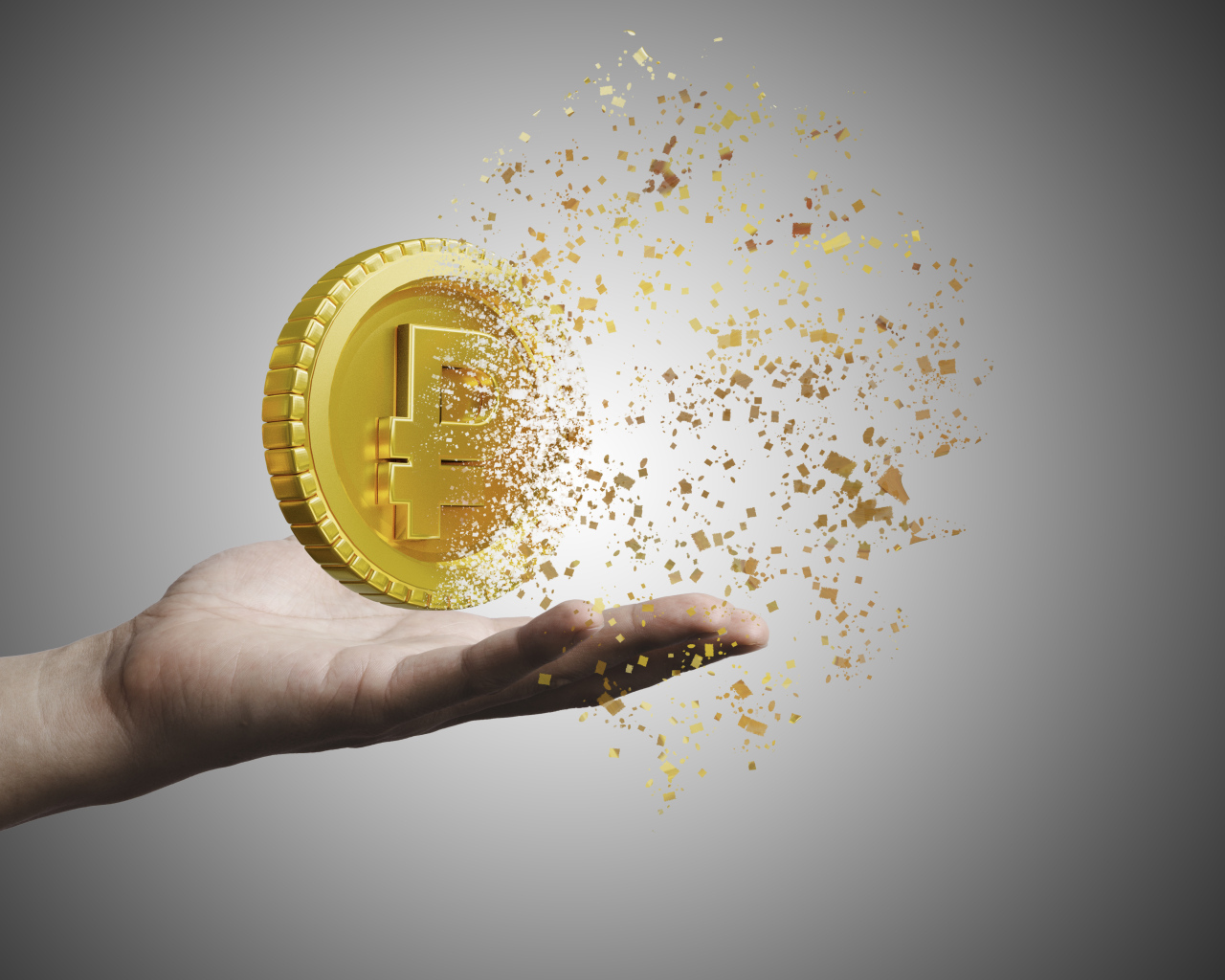 Монета разрушается на ладони на сером фоне